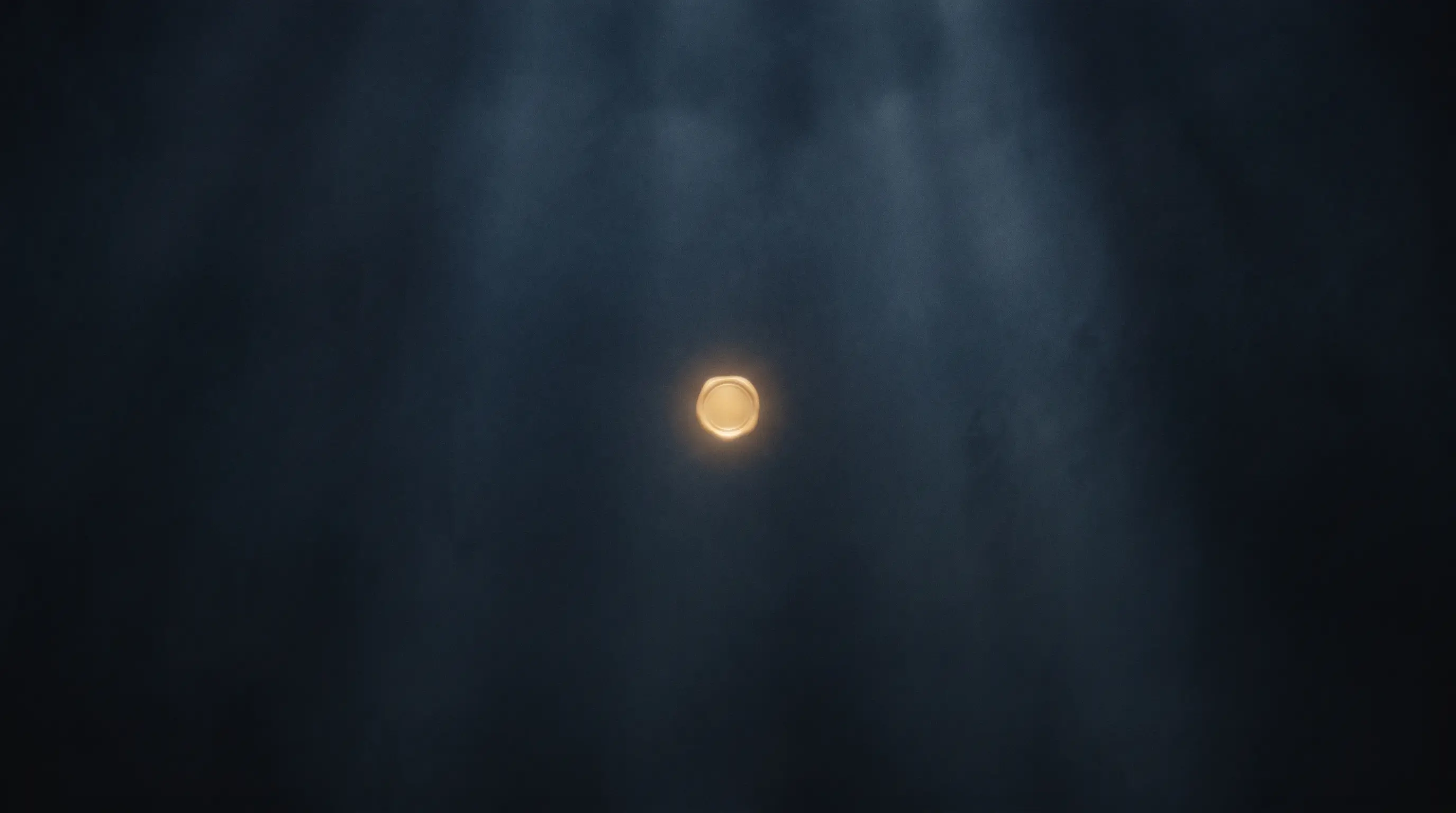 A single gold point of light glowing softly on deep navy — AURUM